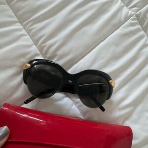 Pomellato Black and Gold Sunglasses Round Frame